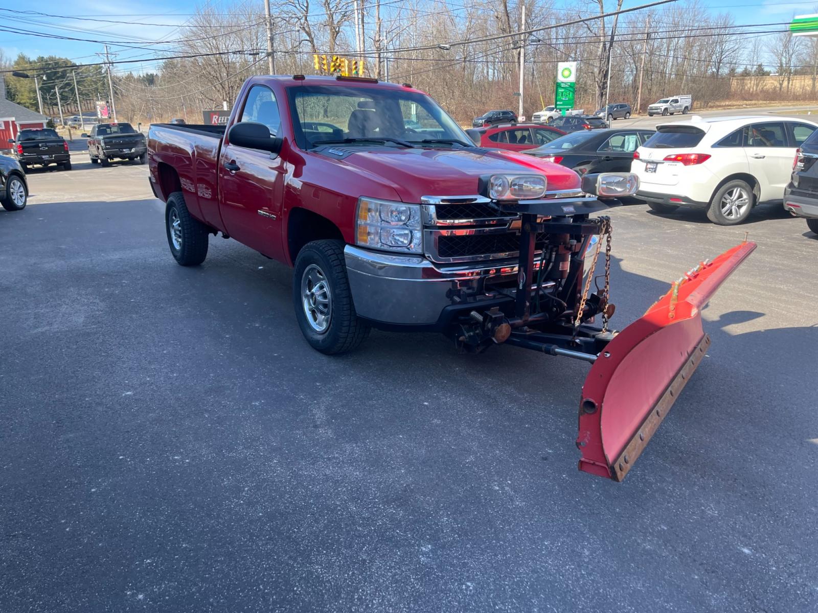 2011 Red /Black Chevrolet Silverado 2500HD Work Truck Long Box 4WD (1GC0KVCG8BF) with an 6.0L V8 OHV 16V FFV engine, 6-Speed Automatic transmission, located at 11115 Chardon Rd. , Chardon, OH, 44024, (440) 214-9705, 41.580246, -81.241943 - This 2011 Chevrolet Silverado 2500 Work Truck with a Regular Cab featuring a 6.0L Vortec V8 and a 6-speed transmission is a robust and versatile pickup designed for heavy-duty tasks. Its significant powertrain is well-suited for towing and hauling heavy loads, making it an ideal choice for work in c - Photo #3